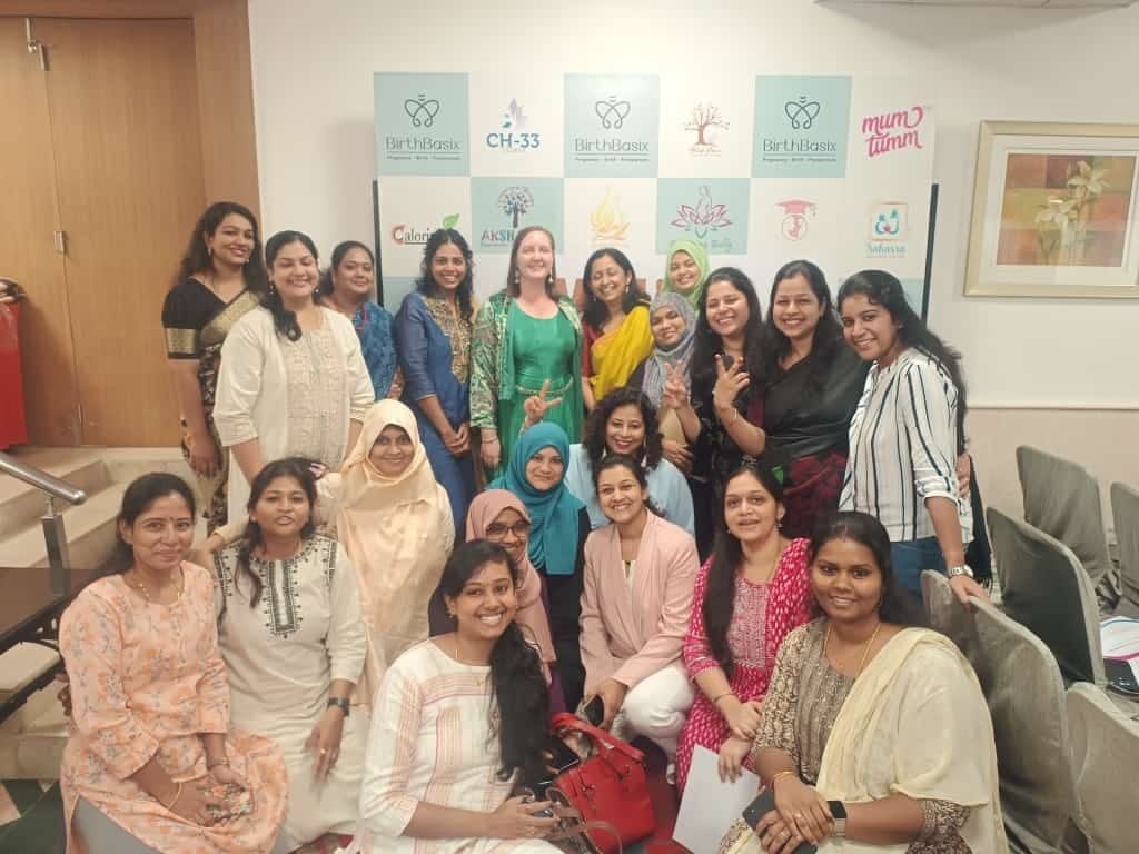 Ayisha Chandni with a group of maternal health professionals and organisations
